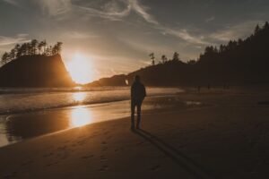 person walking outdoors sunrise